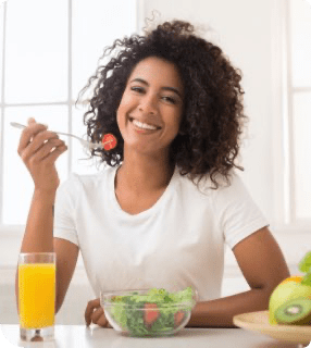 Lady Eating Salad Smiling Curbs Food Cravings